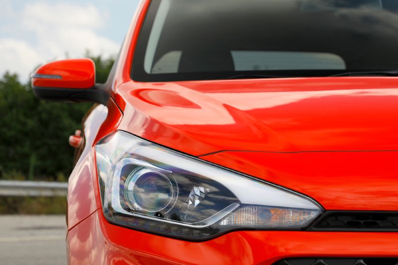 Closeup image of a red sedan